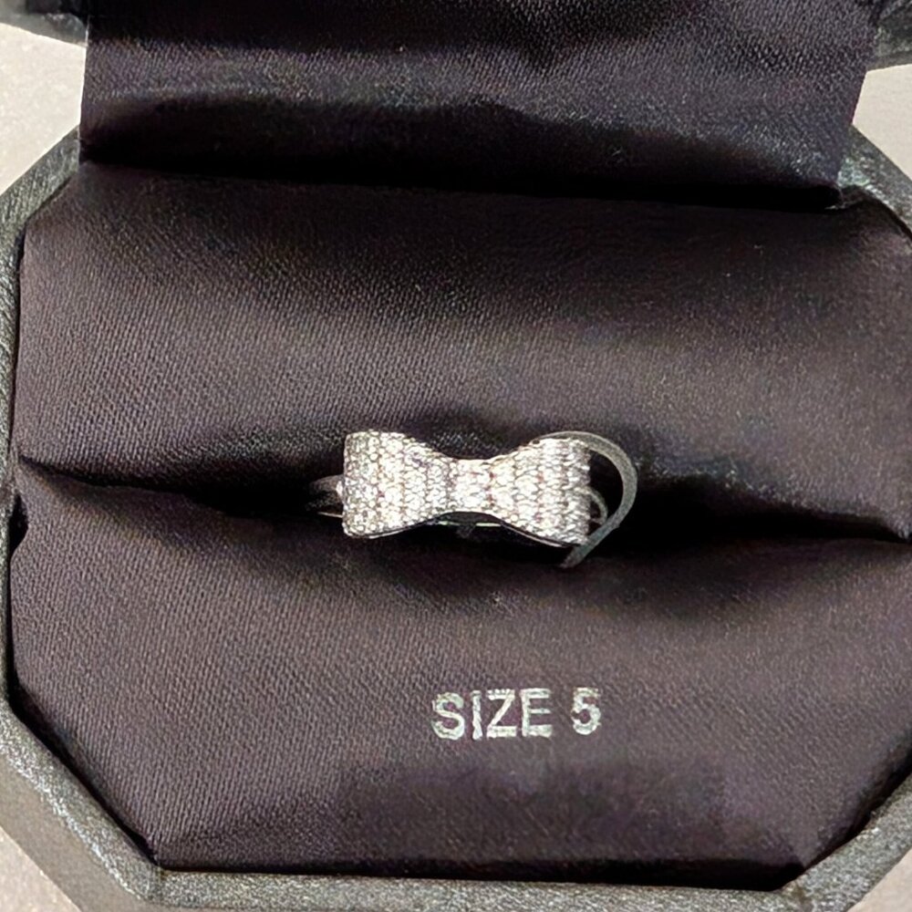 Dillard's dainty silver and faux diamond bow ring
